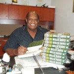 Willie Davis signing books